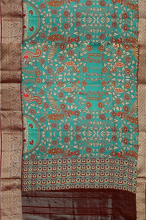 Dola silk saree with floral vines & peacocks in green