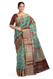 Dola silk saree with floral vines & peacocks in green