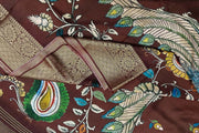 Dola silk saree with floral vines , peacocks and paisley motifs in brown