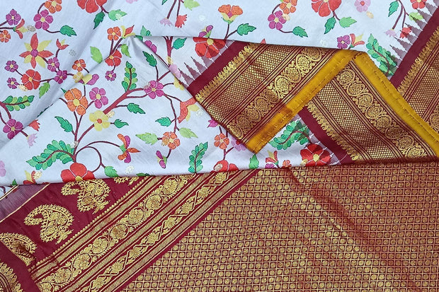 Handwoven Gadwal pure silk floral printed saree in lavender  .