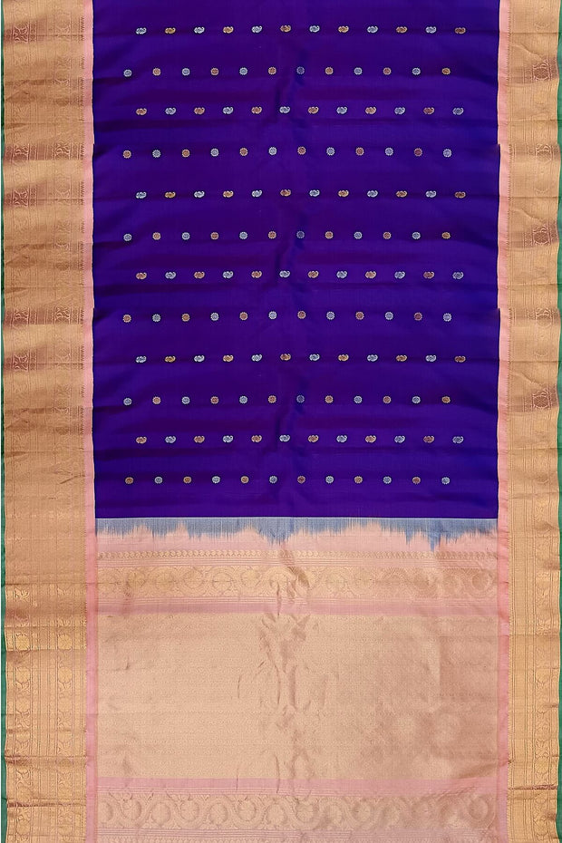 Handwoven Gadwal pure silk saree in purple with floral and paisley  motifs in gold & silver.