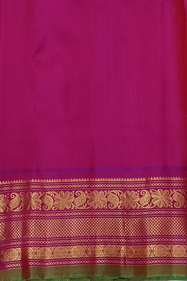 Handwoven Gadwal pure silk saree in yellow with floral   motifs in gold & magenta.