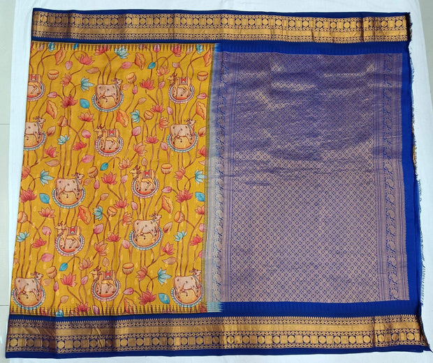 Gadwal pure silk printed pichwai design mustard saree with lotus vines & cows.