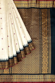 Handwoven Gadwal pure silk saree in off white with meena & gold buttis