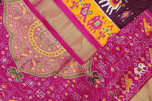Handwoven Ikat pure silk saree in  dark wine  with elephant & bird motifs in skirt border . .