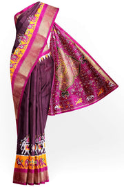 Handwoven Ikat pure silk saree in  dark wine  with elephant & bird motifs in skirt border . .