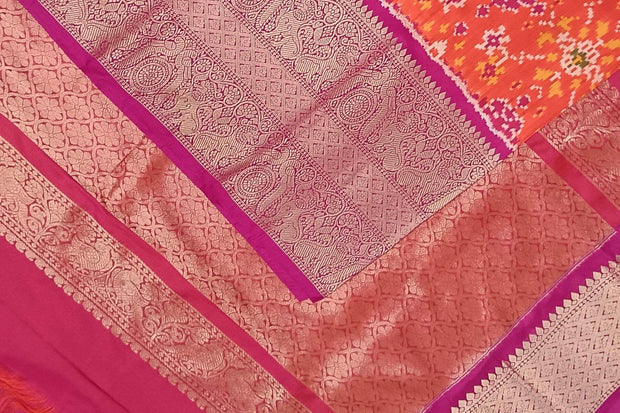 An orange ikat pure silk saree in navratan pattern.