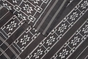 Handwoven ikat pure silk saree in black in telia pattern