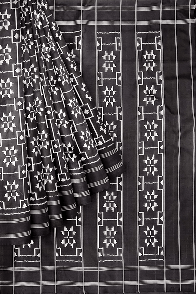 Handwoven ikat pure silk saree in black in telia pattern