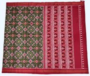 Double ikat pure silk saree in green in  navaratan pattern.