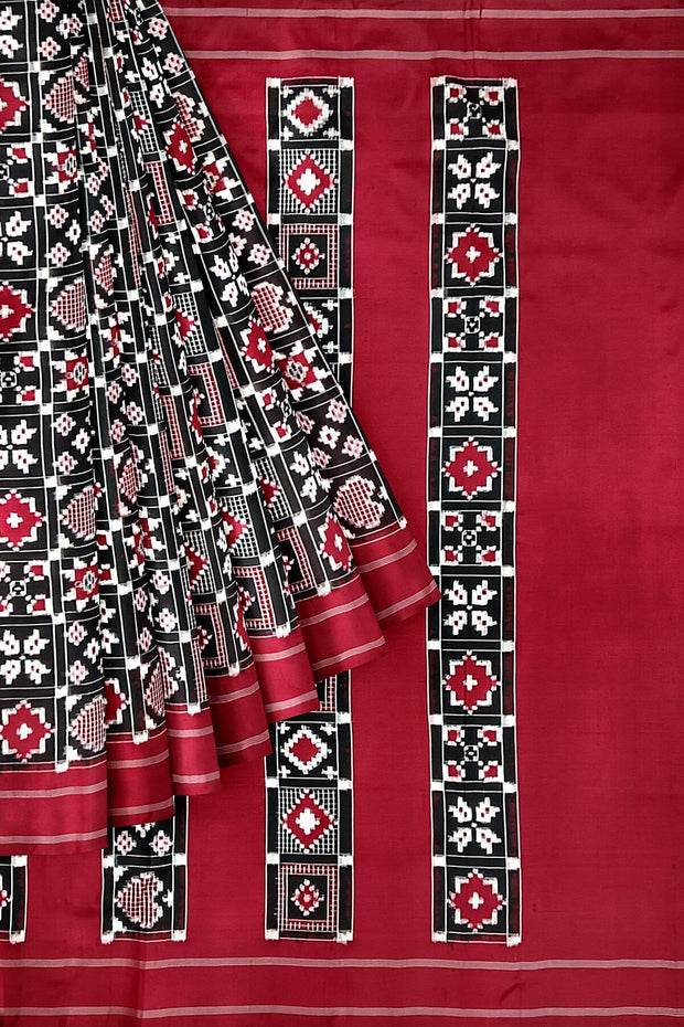 Double Ikat telia pure silk saree in black in 9 motifs pattern.