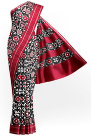 Double Ikat telia pure silk saree in black in 9 motifs pattern.