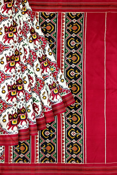 Handwoven double ikat pure silk saree in  white in  chabdi kunj (elephant in circle) pattern.