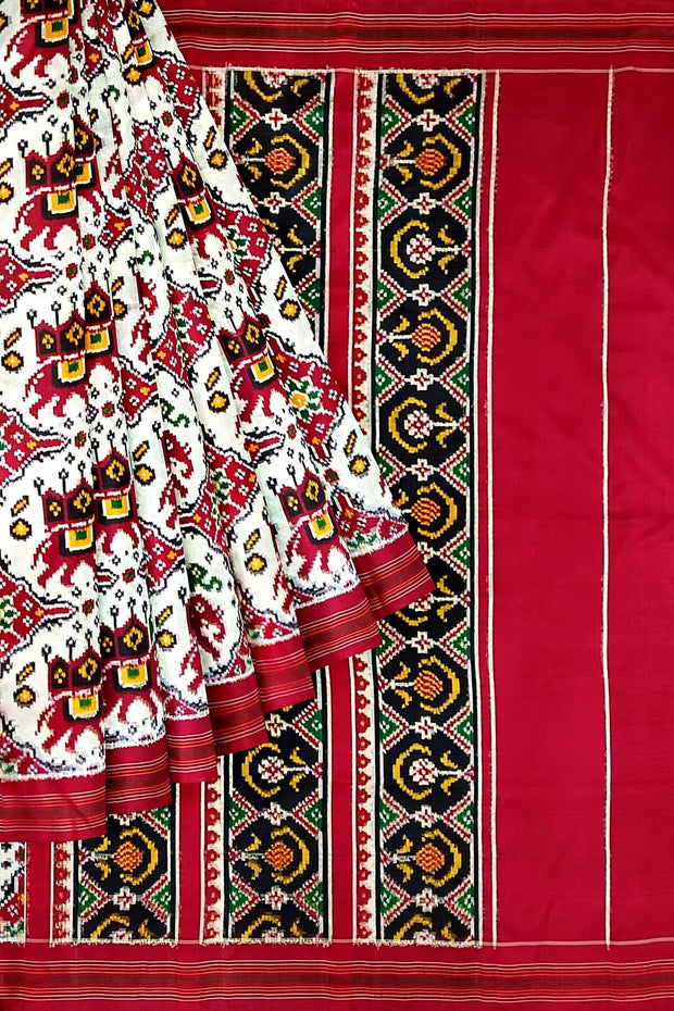 Handwoven double ikat pure silk saree in  white in  chabdi kunj (elephant in circle) pattern.