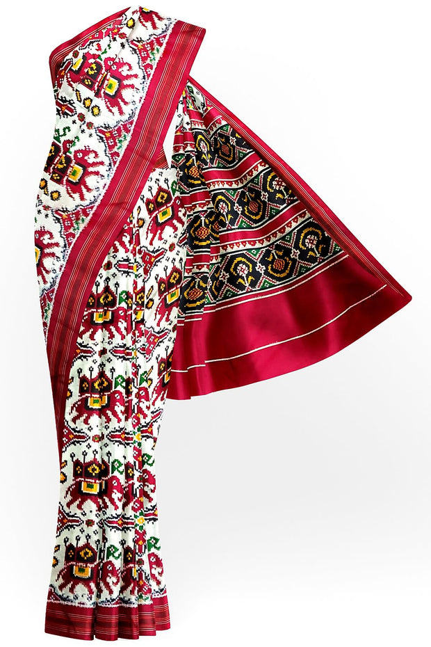 Handwoven double ikat pure silk saree in  white in  chabdi kunj (elephant in circle) pattern.