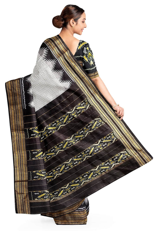 Handwoven Ikat pure silk saree in white checks with temple border.