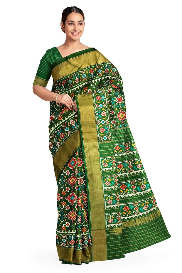 Handwoven ikat pure silk saree in bottle green in navratan pattern