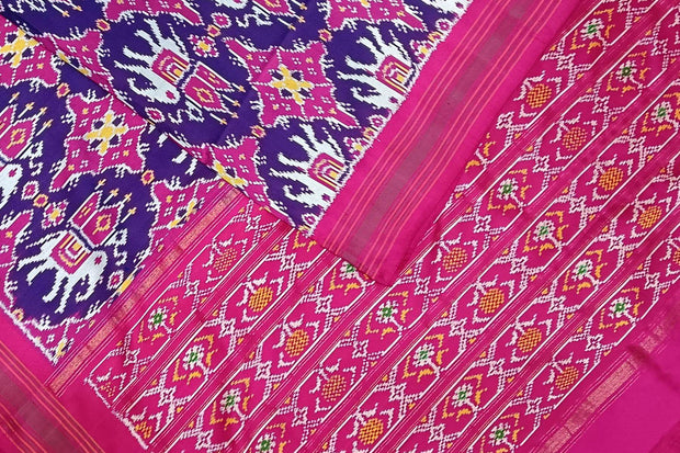 A handwoven  twill weave ikat pure silk saree in violet  with  kunj in chabdi