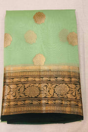 Banarasi kora ( organza) silk saree in pista green with motifs