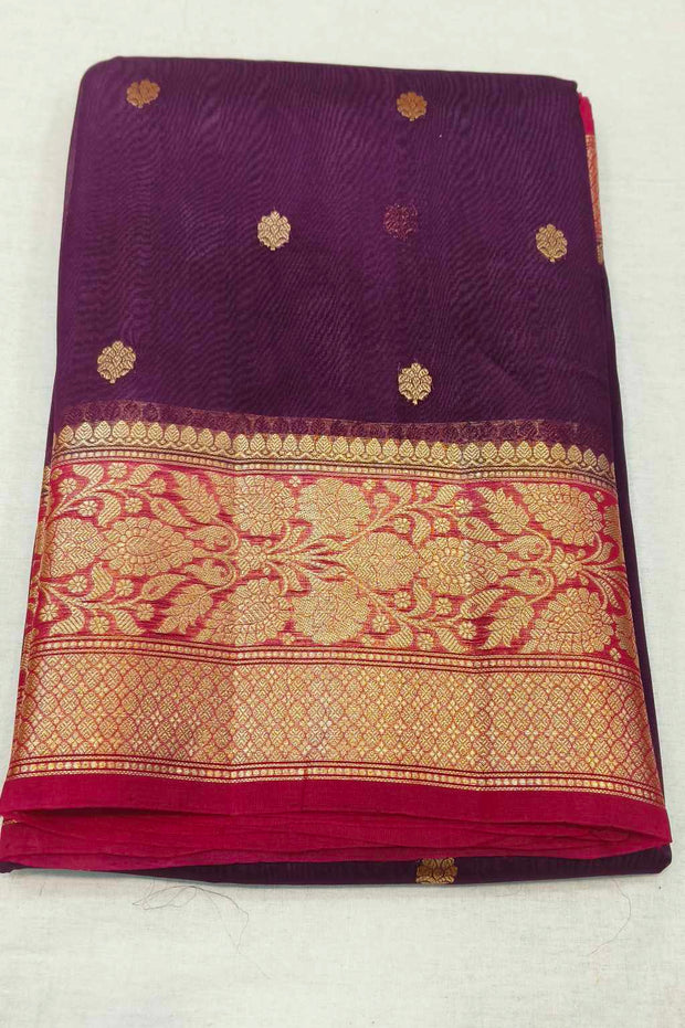 Banarasi kora ( organza) silk saree in purple with  gold motifs.