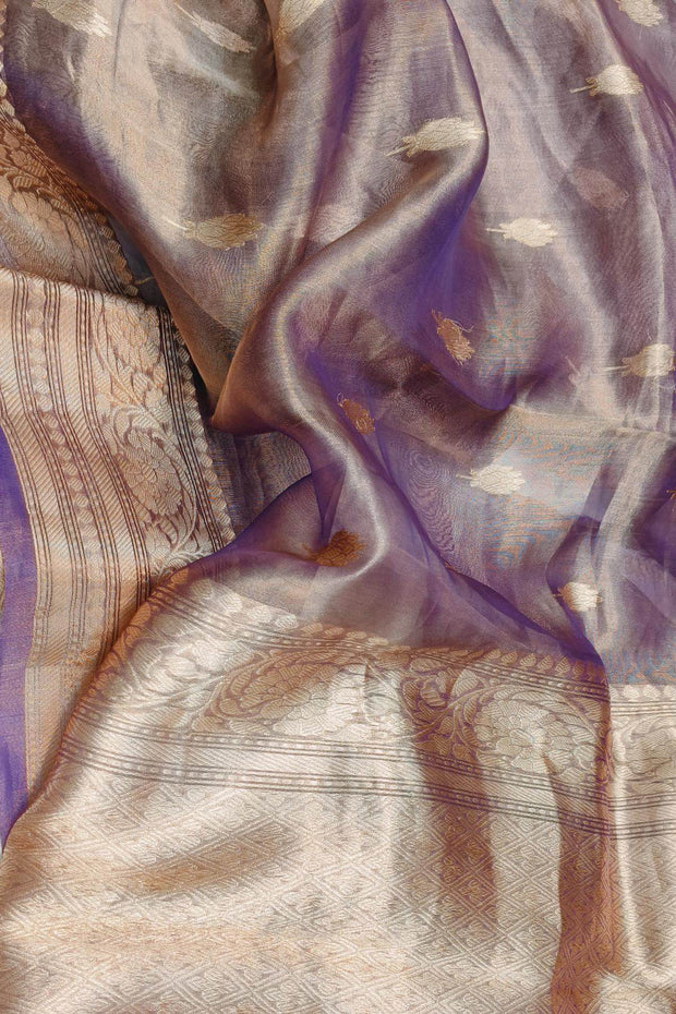 Violet silk tissue handloom Banarasi saree with floral motifs in gold.