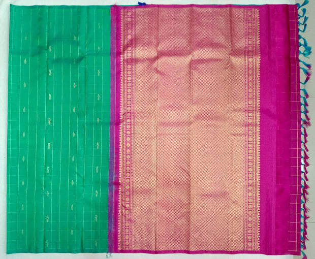 Kanchi borderless pure silk saree in teal green in checks