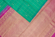 Kanchi borderless pure silk saree in teal green in checks