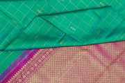 Kanchi borderless pure silk saree in teal green in checks