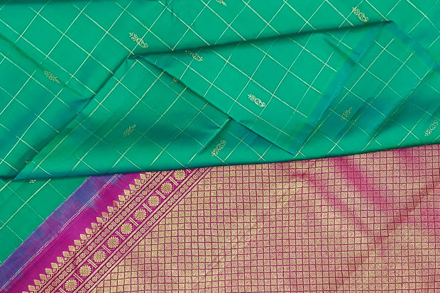 Kanchi borderless pure silk saree in teal green in checks