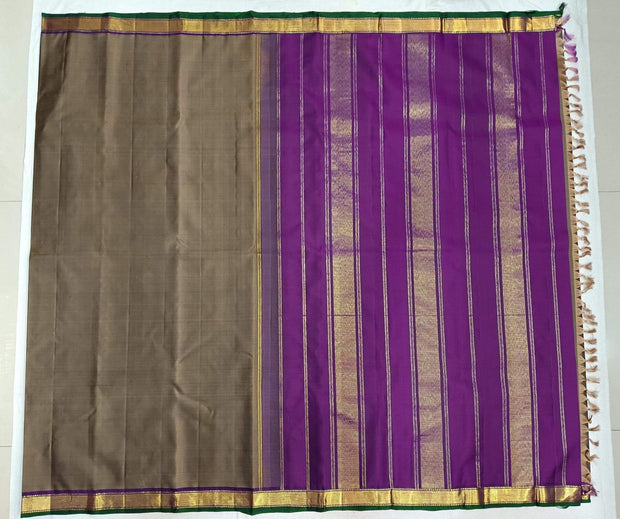 Kanchi pure silk saree in grey shade with a striped contrast pallu