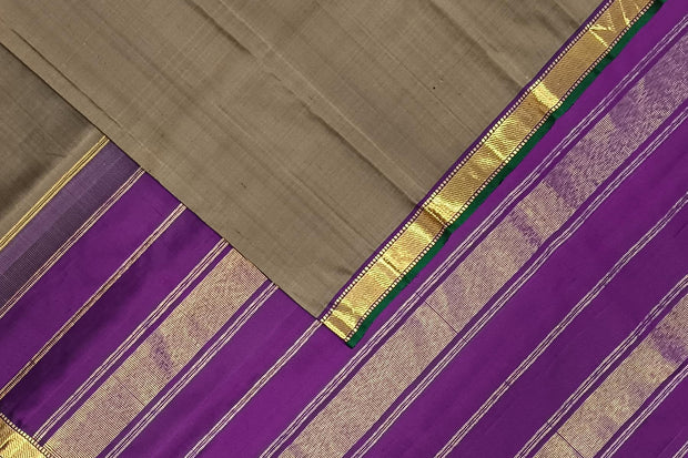 Kanchi pure silk saree in grey shade with a striped contrast pallu