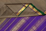 Kanchi pure silk saree in grey shade with a striped contrast pallu