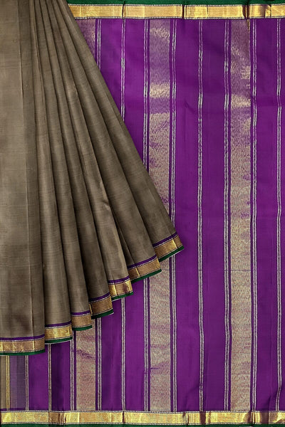 Kanchi pure silk saree in grey shade with a striped contrast pallu