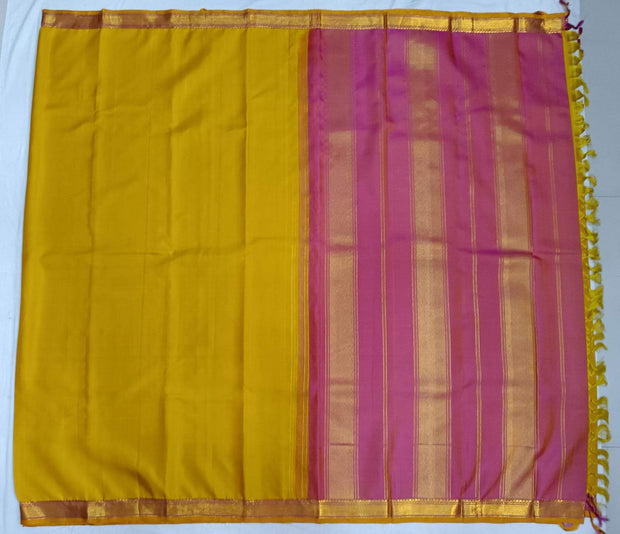 Kanchi pure silk saree in lemon green with a striped contrast pallu