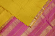 Kanchi pure silk saree in lemon green with a striped contrast pallu