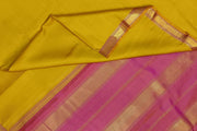 Kanchi pure silk saree in lemon green with a striped contrast pallu