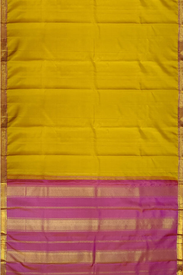 Kanchi pure silk saree in lemon green with a striped contrast pallu