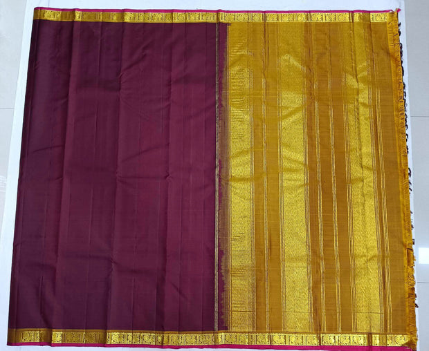 Kanchi pure silk saree in brown with a striped contrast pallu