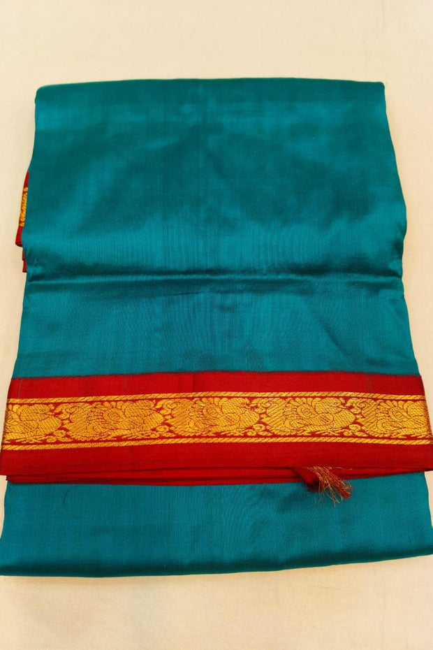 Kanchi pure silk saree in peacock blue with red border. ( 9 yards)