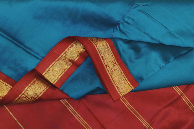 Kanchi pure silk saree in peacock blue with red border. ( 9 yards)