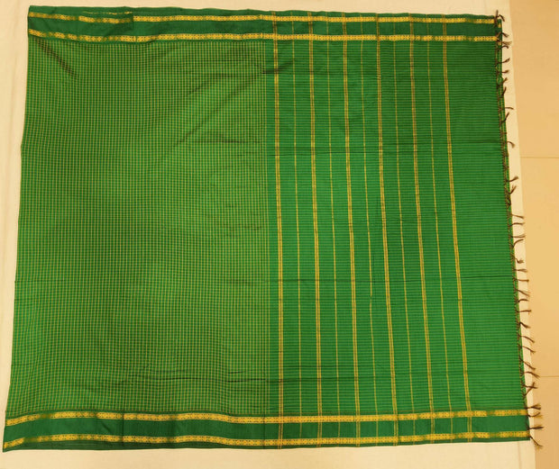 Fine checks cotton saree in  green.