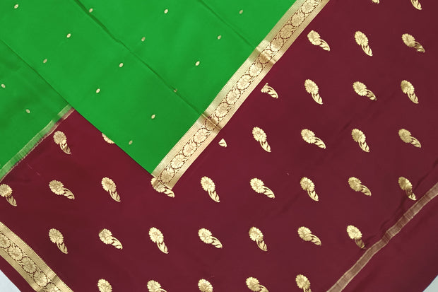 Mysore crepe silk saree in green with small motifs all over the body.