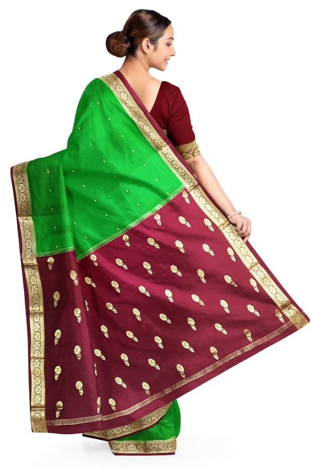 Mysore crepe silk saree in green with small motifs all over the body.