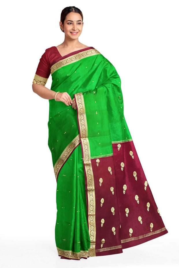 Mysore crepe silk saree in green with small motifs all over the body.