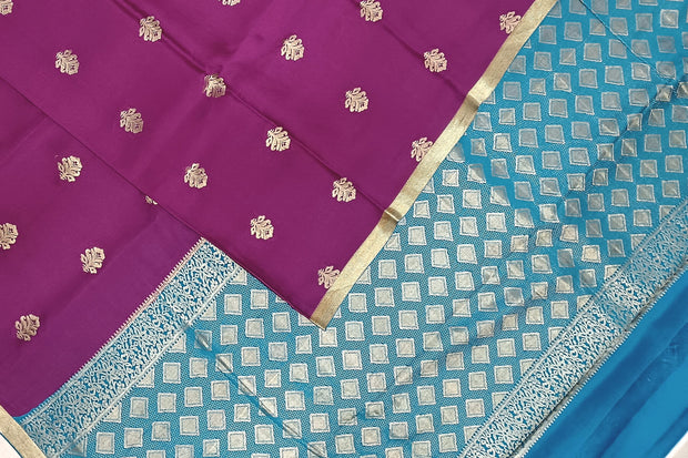 Mysore crepe silk saree in purple with floral  motifs all over the body.