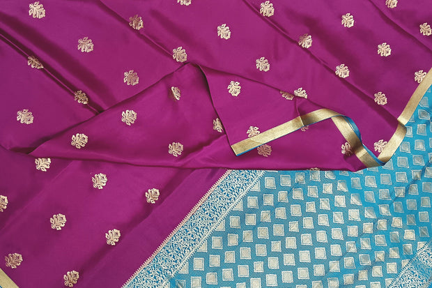 Mysore crepe silk saree in purple with floral  motifs all over the body.