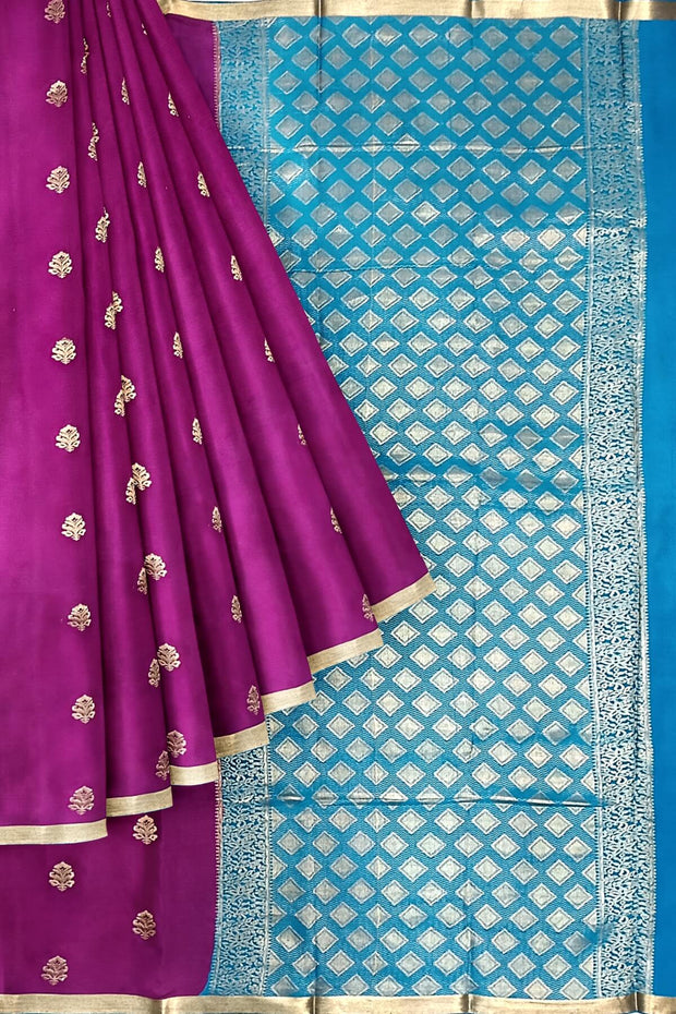 Mysore crepe silk saree in purple with floral  motifs all over the body.