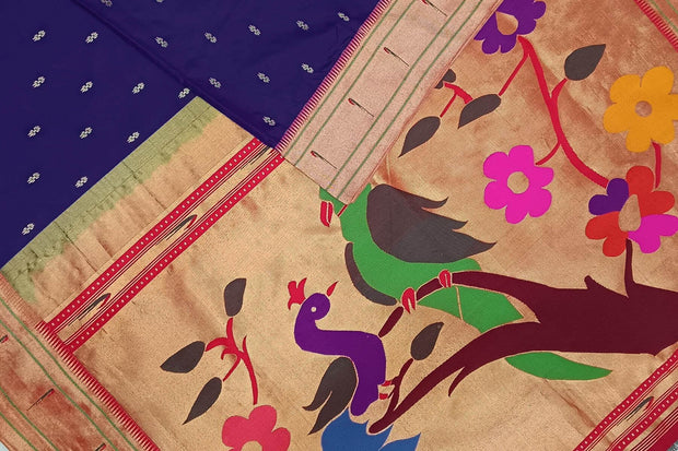 Paithani pure silk saree in blue  with small motifs and a fancy pallu with muniya border