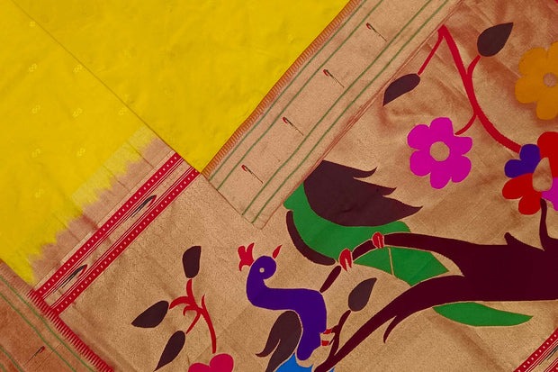 Paithani pure silk saree in yellow  with small motifs and a fancy pallu with muniya border