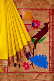 Paithani pure silk saree in yellow  with small motifs and a fancy pallu with muniya border